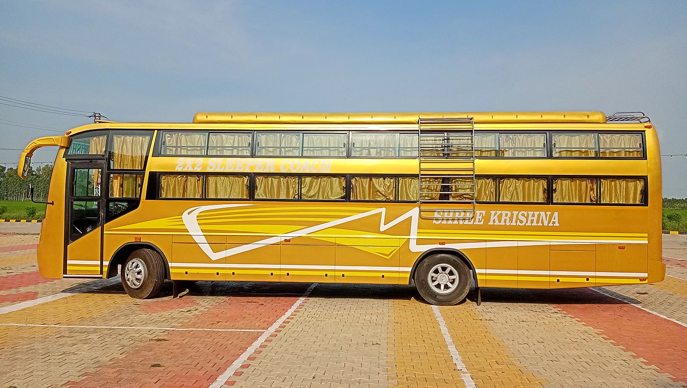 Full side profile of a Unitech Motors sleeper coach